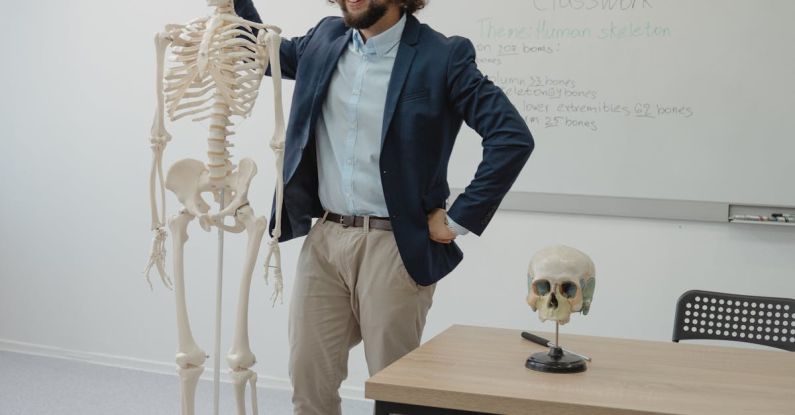Standing Desks - Man Standing beside a Human Skeleton