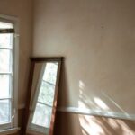 Cultural Awareness - Depressed Man sitting on a Wooden Floor
