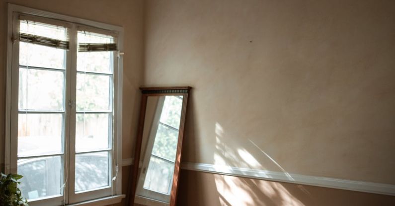 Cultural Awareness - Depressed Man sitting on a Wooden Floor