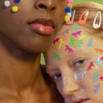 Individuals - Diverse friends with colorful cotton balls and many stickers on faces on green background