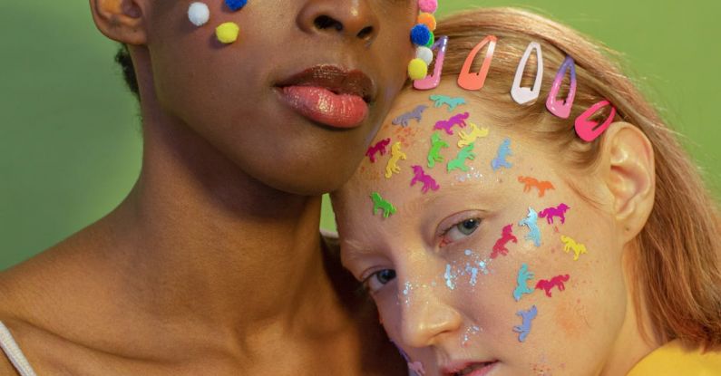 Individuals - Diverse friends with colorful cotton balls and many stickers on faces on green background