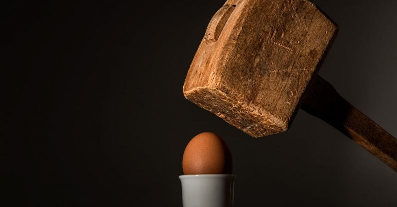 Vulnerability - Brown Wooden Mallet Near Brown Chicken Egg