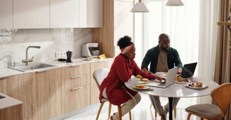 Eating - Couple Using their Laptops While Having Breakfast
