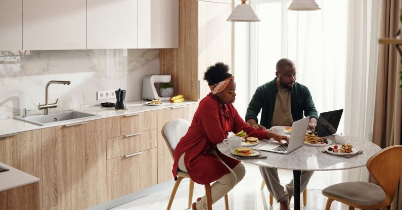 Eating - Couple Using their Laptops While Having Breakfast