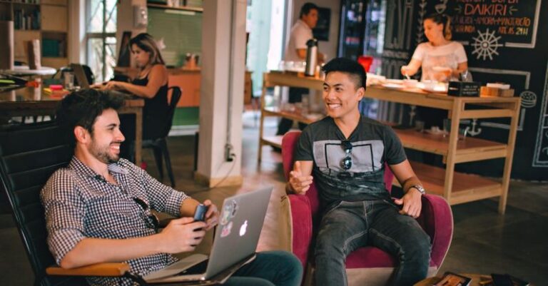 Pet-Friendly Office - Photograph of Men Having Conversation Seating on Chair