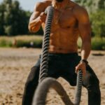 Outdoor Workouts - Man Training Outdoor Using Battle Ropes