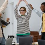 Entrepreneurs - A Group of People Celebrating Together at Work